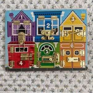 Melissa and Doug latches wooden activity board